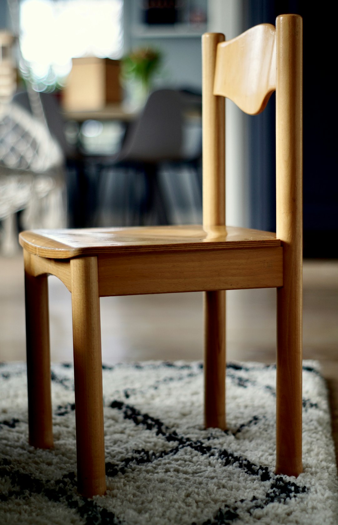 selective focus photo of brown wooden chair