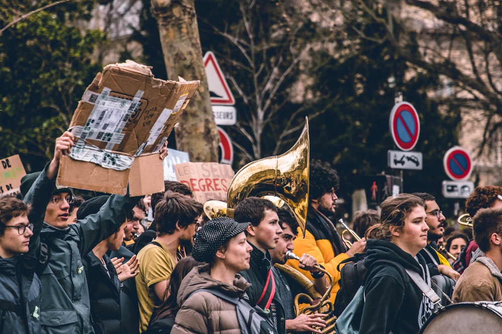 group of people standing on the street