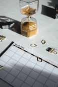 time management calendar and sand timer