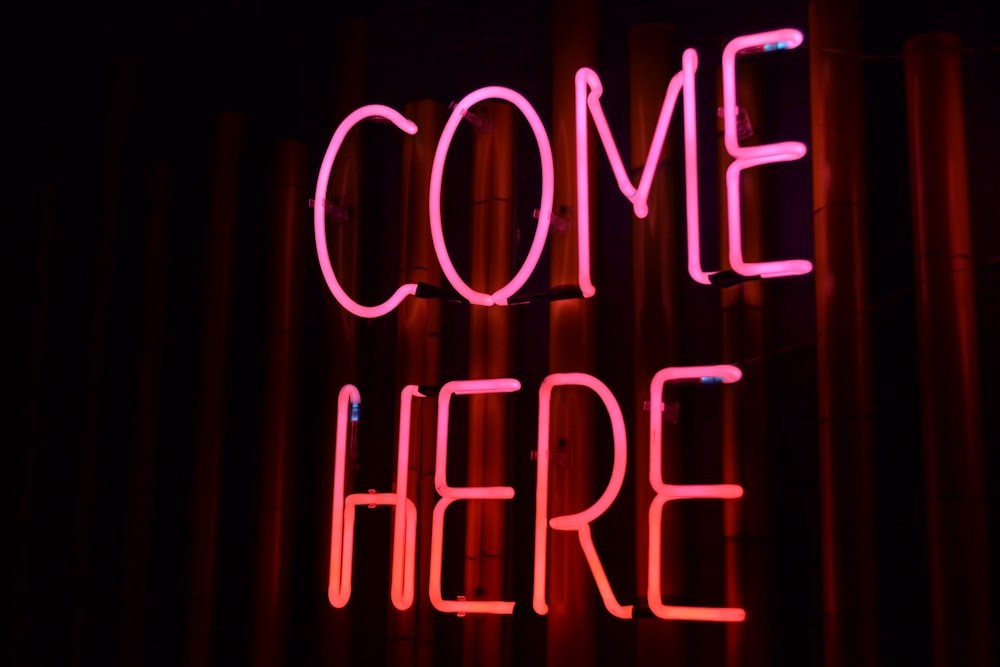 lighted come here neon sign