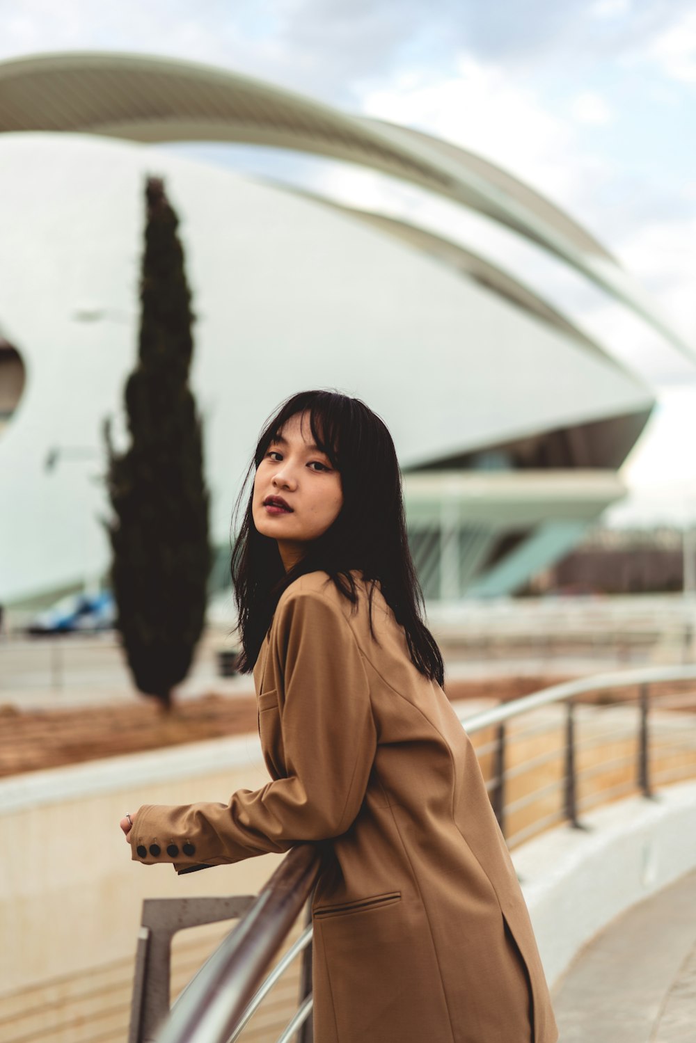 woman wearing brown long-sleeved dress