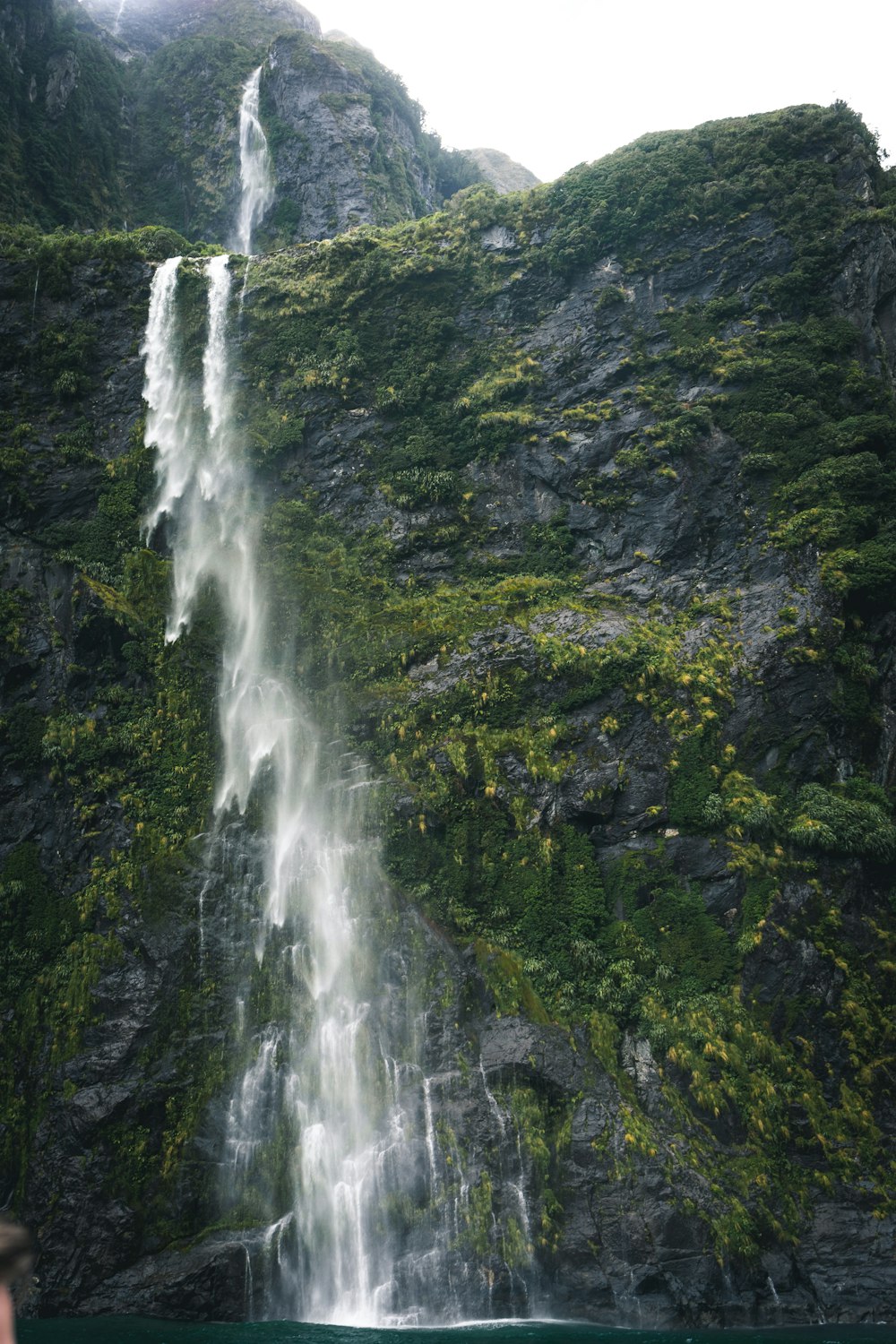 water falls by the mountain