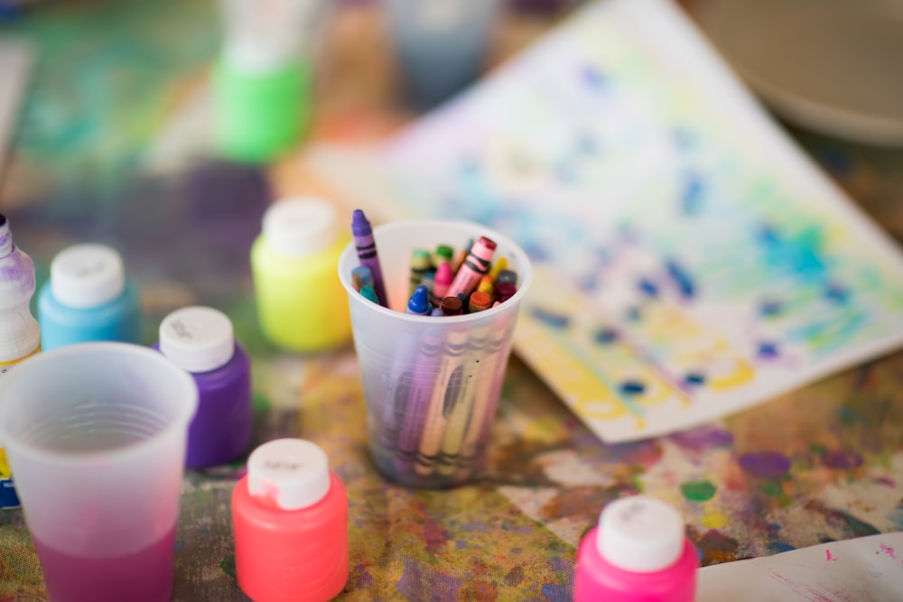 close-up photography of plastic containers and colors