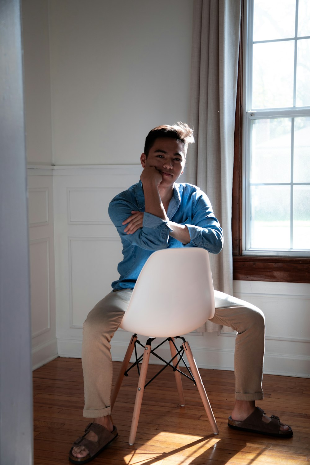 man sitting on Eiffel chair