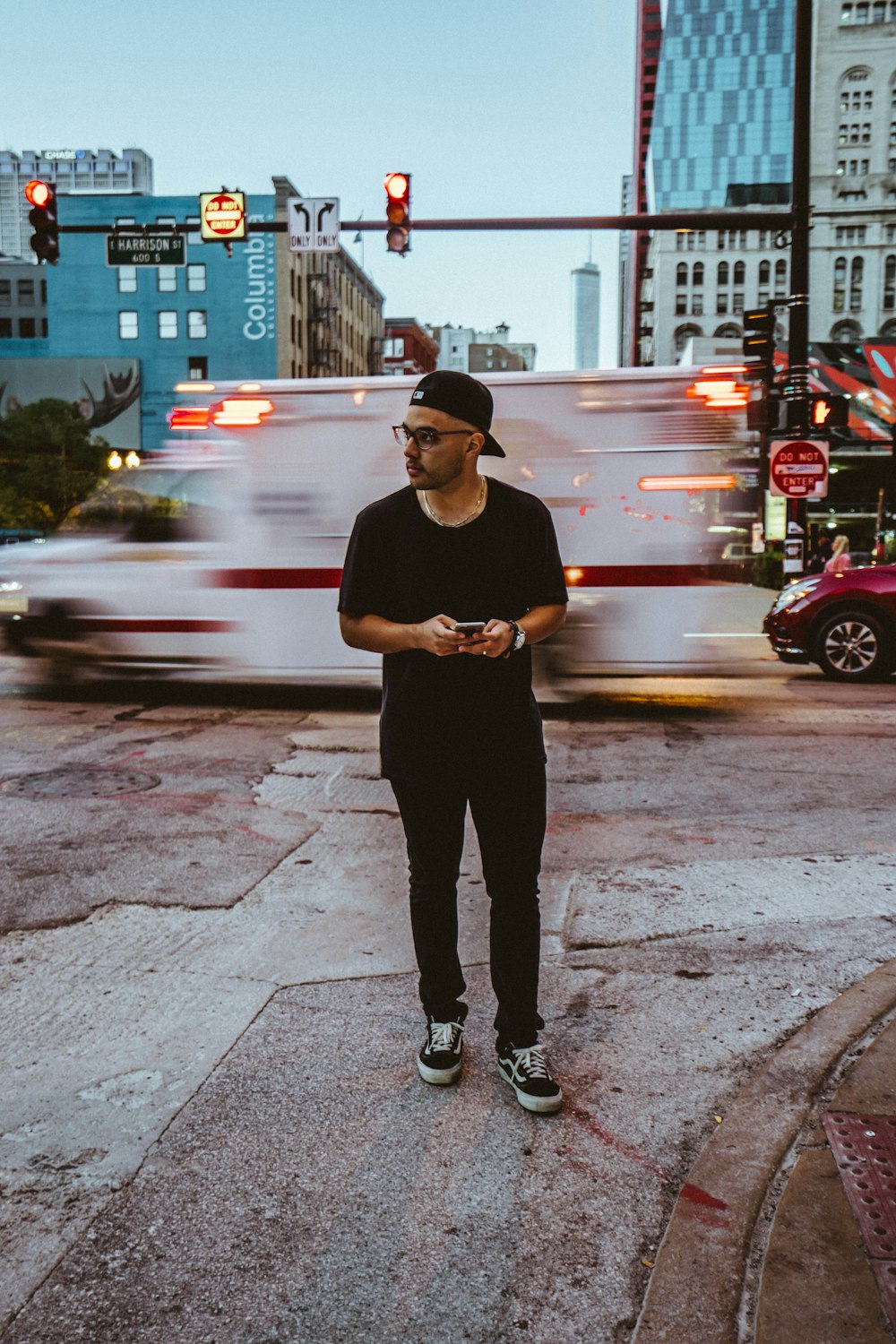 man standing beside vehicle