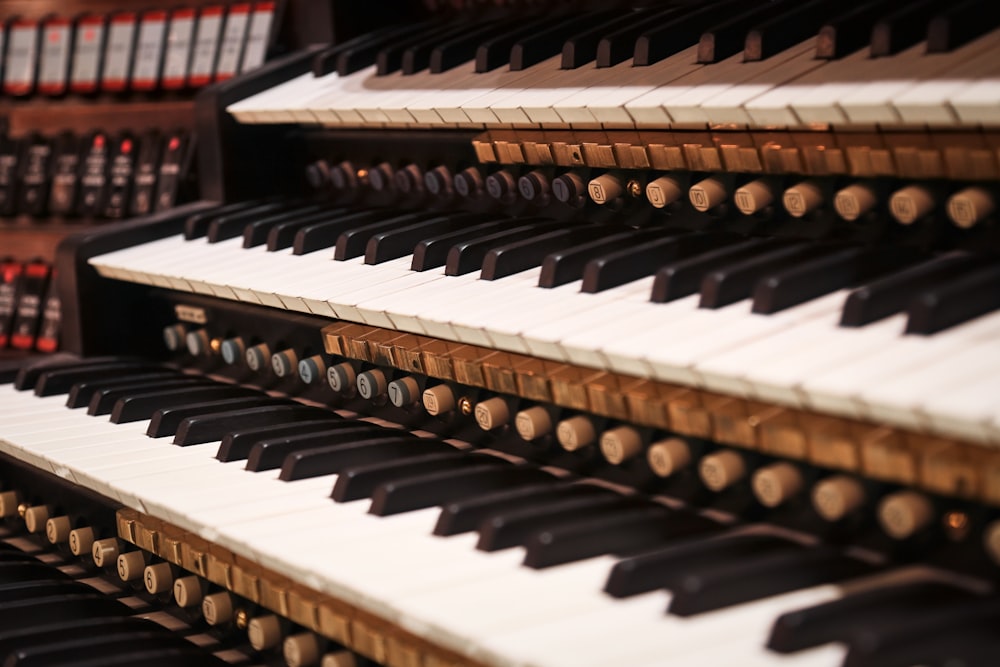 a close up of a row of musical keyboards