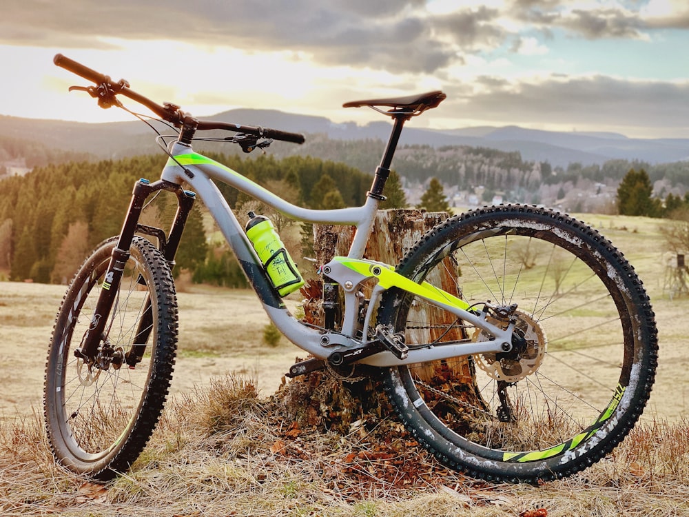 white full-suspension bike on grass