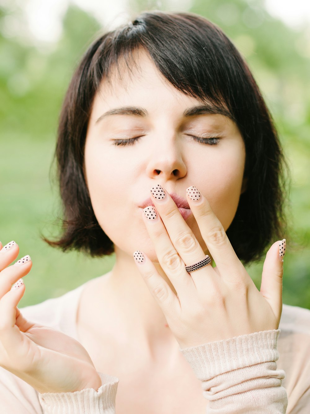 woman touching lips with left hand