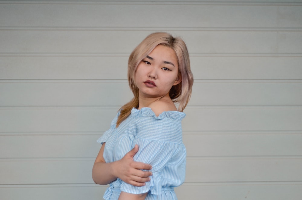 woman in blue off shoulder top