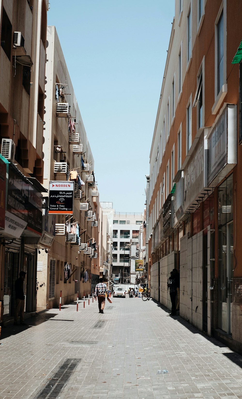 man walking on concrete walkway