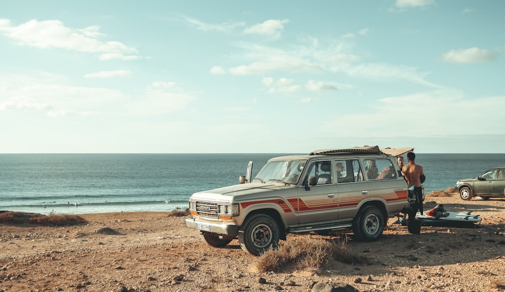 silver SUV near beach