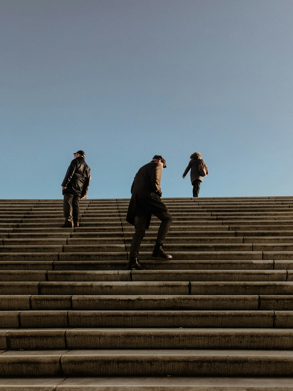 low angle photo of people walking on stairways