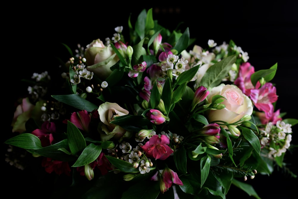 white, pink, and purple flower arrangement