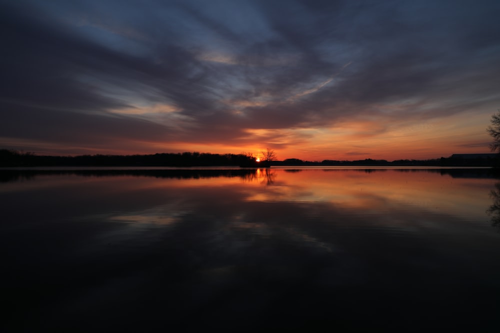 calm body of water during golden hour