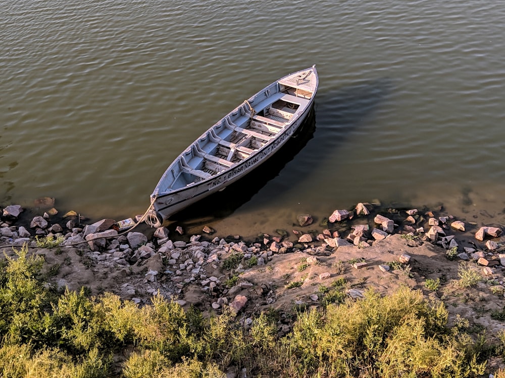 brown and white canoe boat