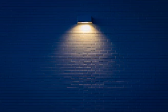 wall lamp turned on on wall