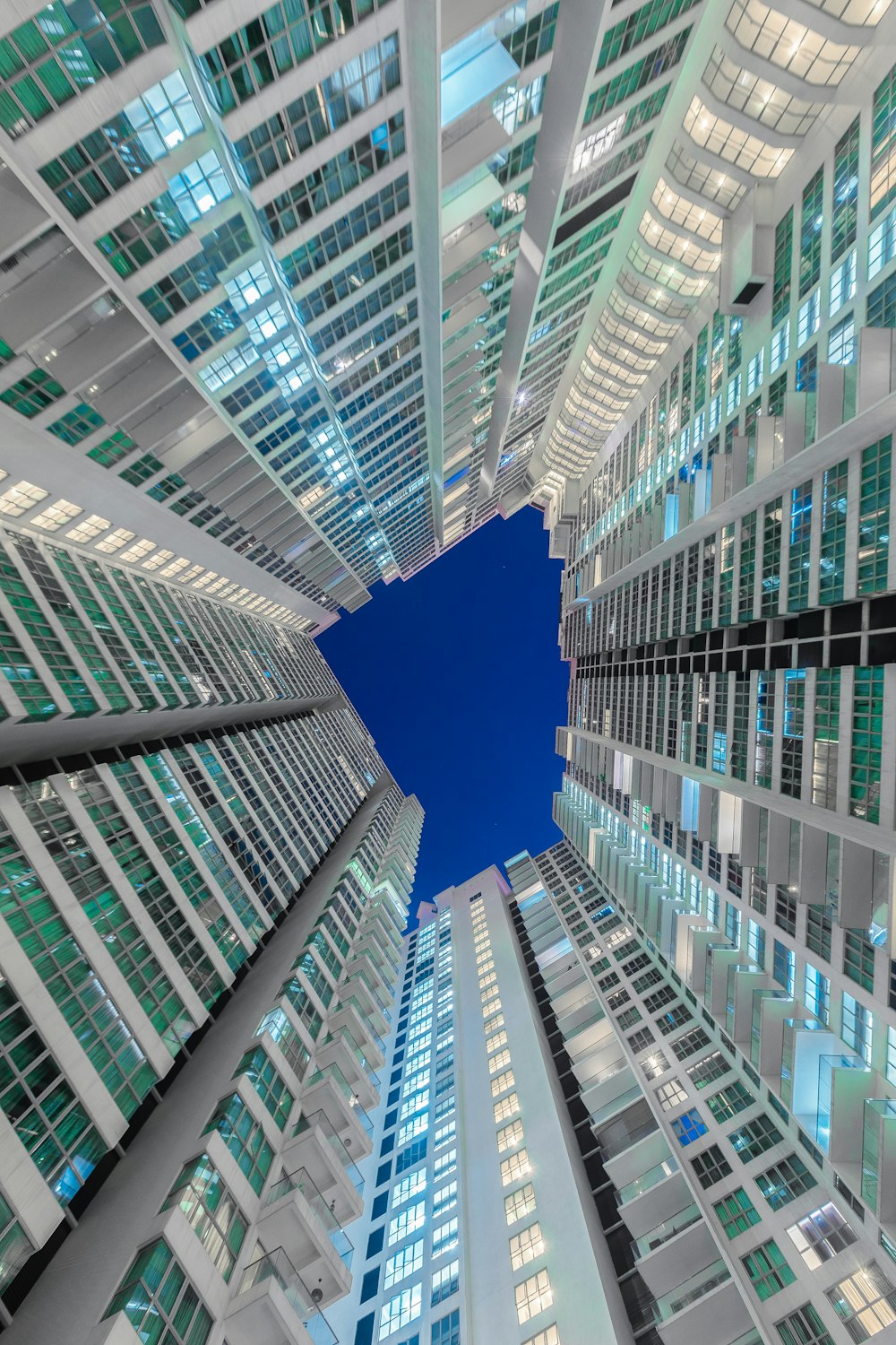 low angle photography of glass curtain buildings