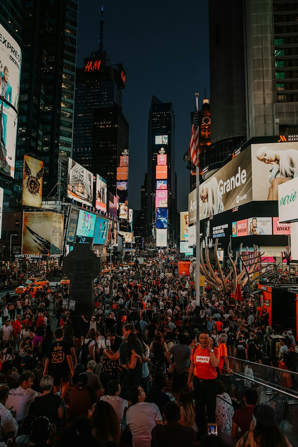 huge crowd of people at New York Times Square at night