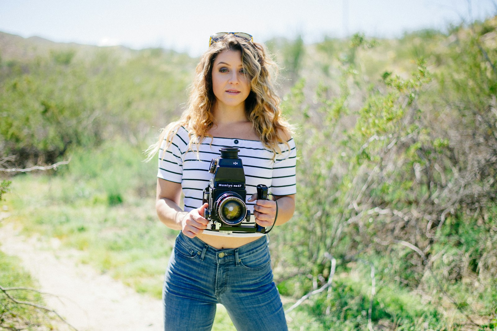 Nikon Df sample photo. Woman holding camera standing photography