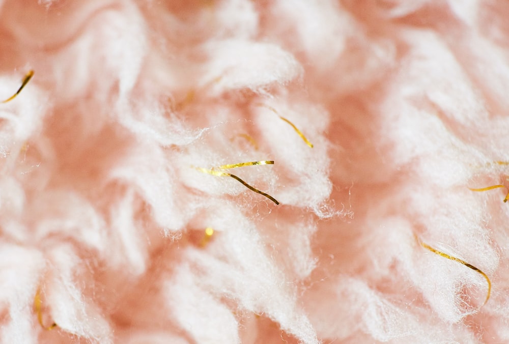 a close up of a pile of white wool