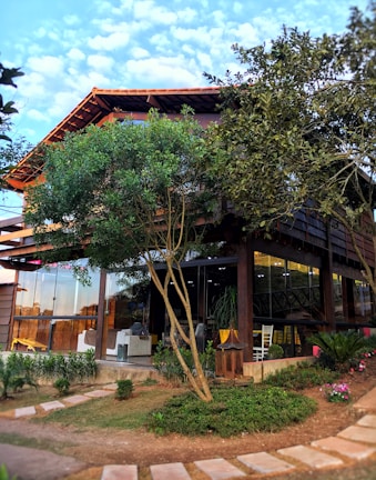 Exterior view of the Funabedules building surrounded by lush greenery.