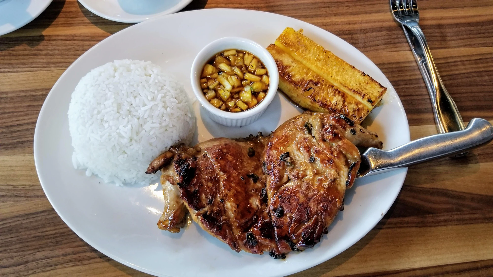Golden-brown chicken adobo pieces glazed in dark reduced sauce