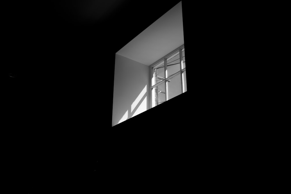 view of glass window from dark room
