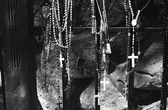 Religious gift items including rosaries and prayer cards, styled with a dark, somber tone reflecting the Death Korps theme.