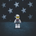 Lego astronaut on gray surface