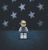 Lego astronaut on gray surface