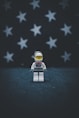 Lego astronaut on gray surface