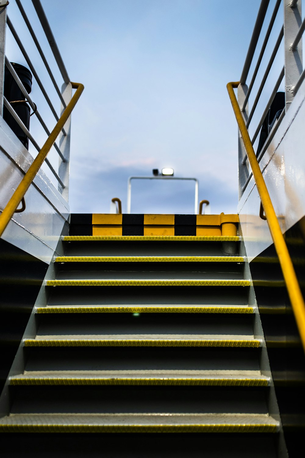 yellow and gray metal stairs