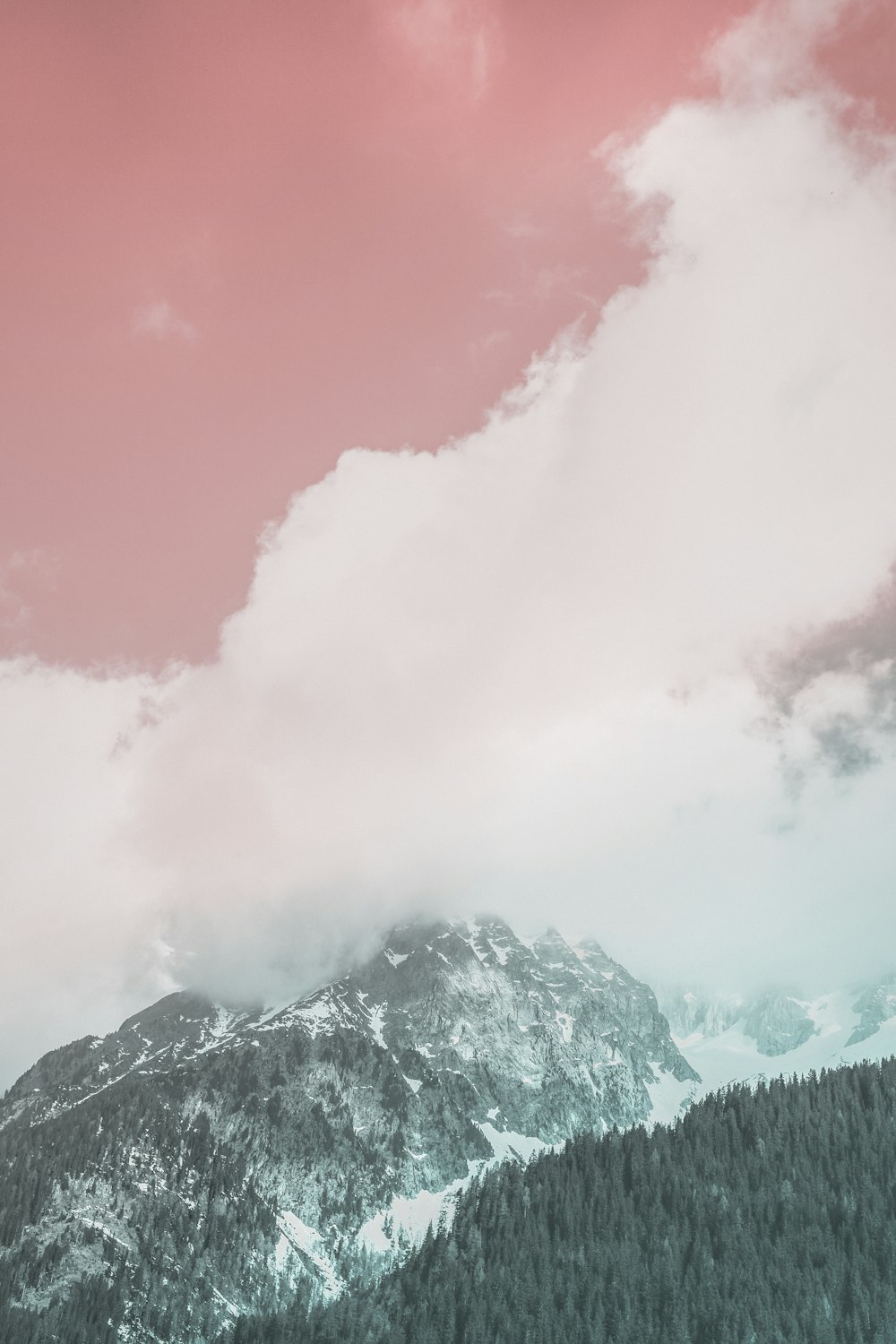 aerial view of mountains under cloudy sky