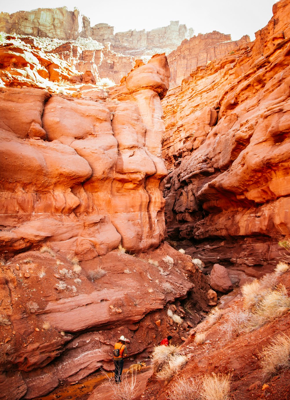 people standing near rock formation