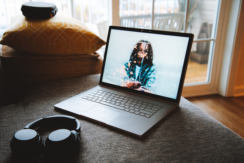 MacBook Pro near wireless headphones