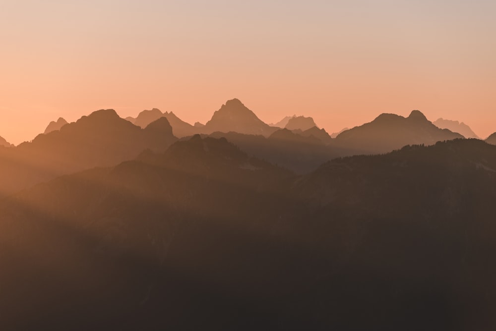 silhouette of mountains during golden hour