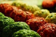 A close-up of colorful cornhole bags ready for play.
