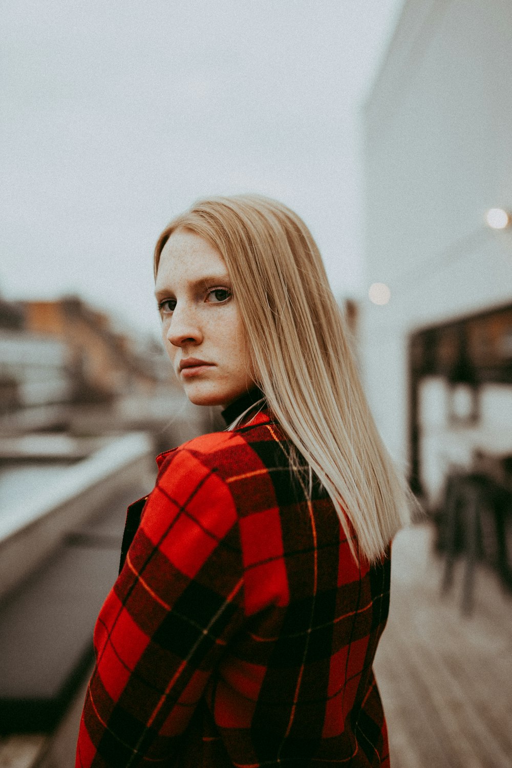 woman wearing black and red plaid jacket