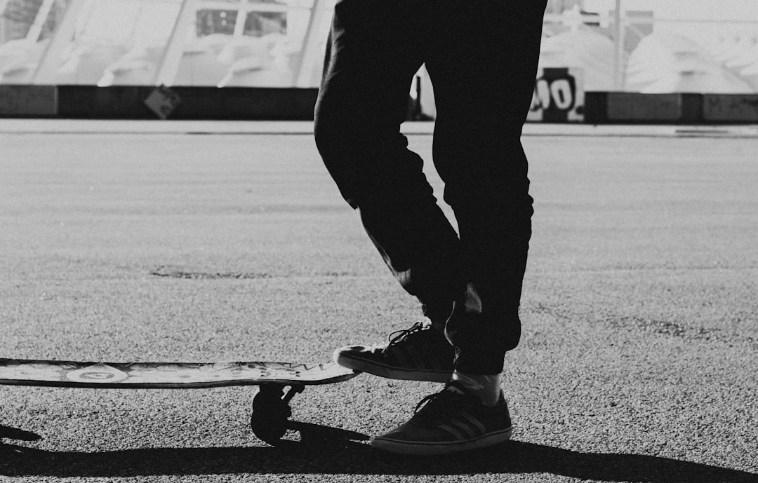 grayscale photo of skateboard