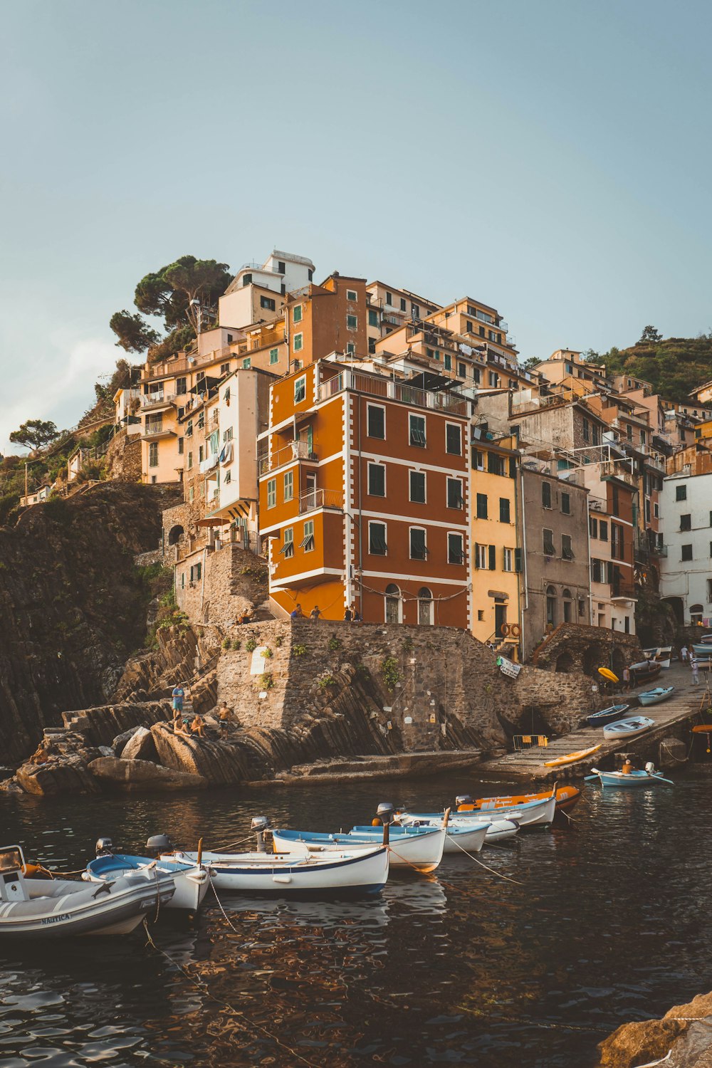 photography of boats and concrete building