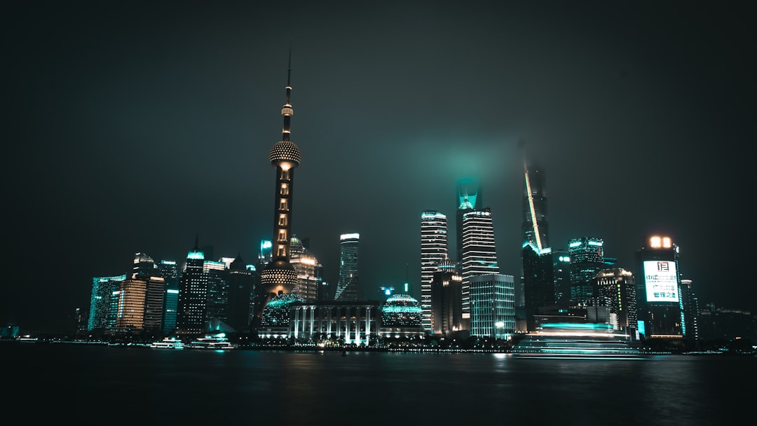 low angle photography of city near body of water,