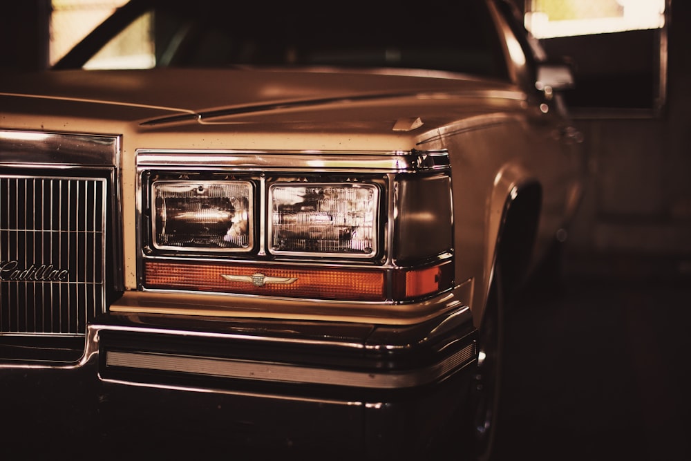 selective focus photo of white Cadillac car