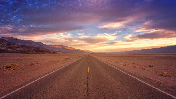 Desert highway at sunset