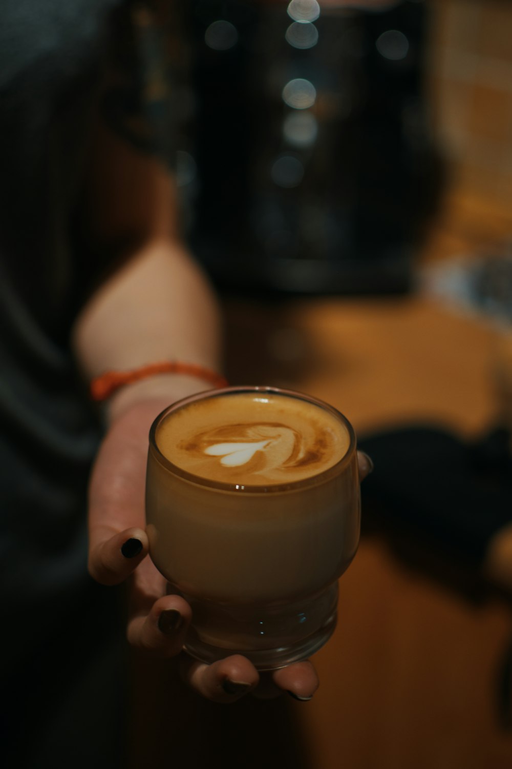 person holding cappuccino