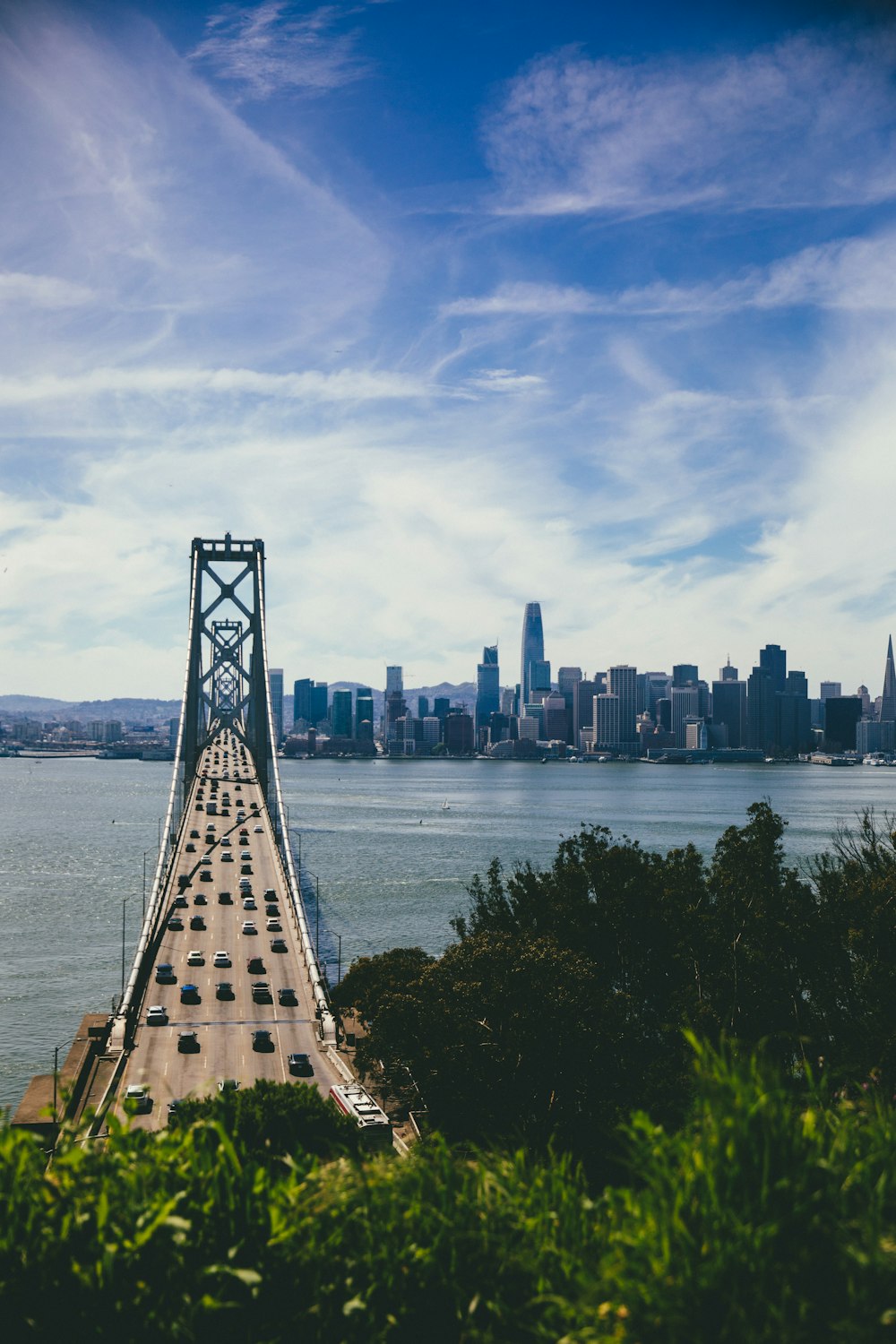 vehicles crossing on bridge during daytime