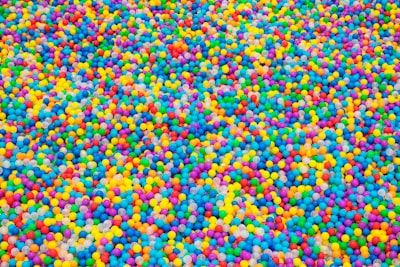 pile of assorted-color play balls confectionery zoom background