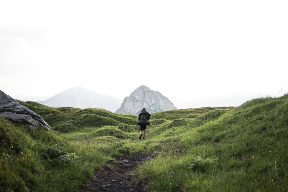 person about to claim mountain