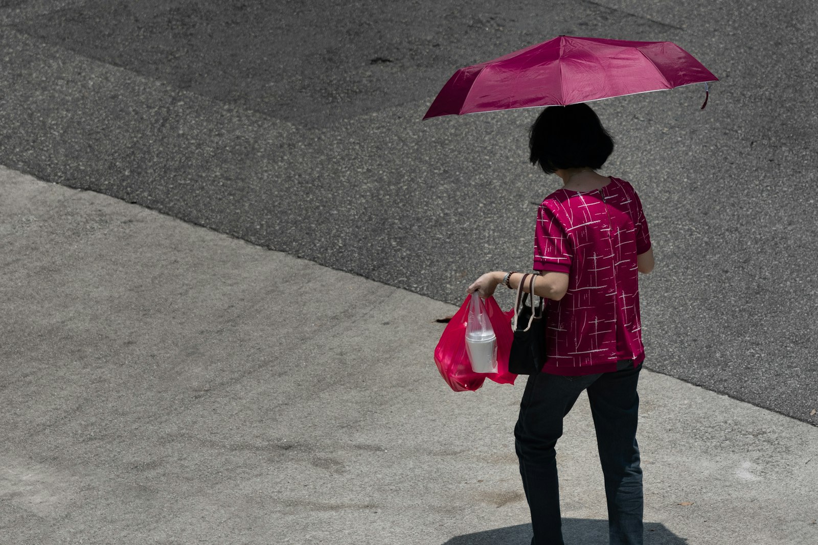 Nikon Nikkor AF-S 300mm F4E PF ED VR sample photo. Woman carrying bags while photography