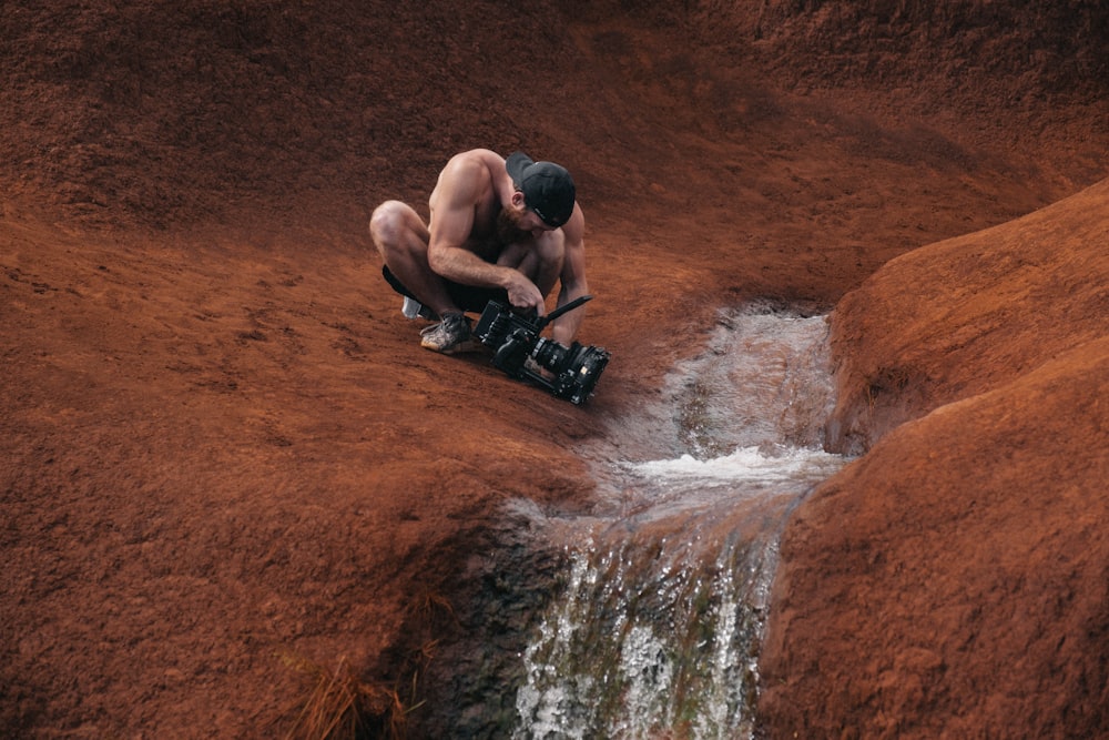 man videoing waterwalls