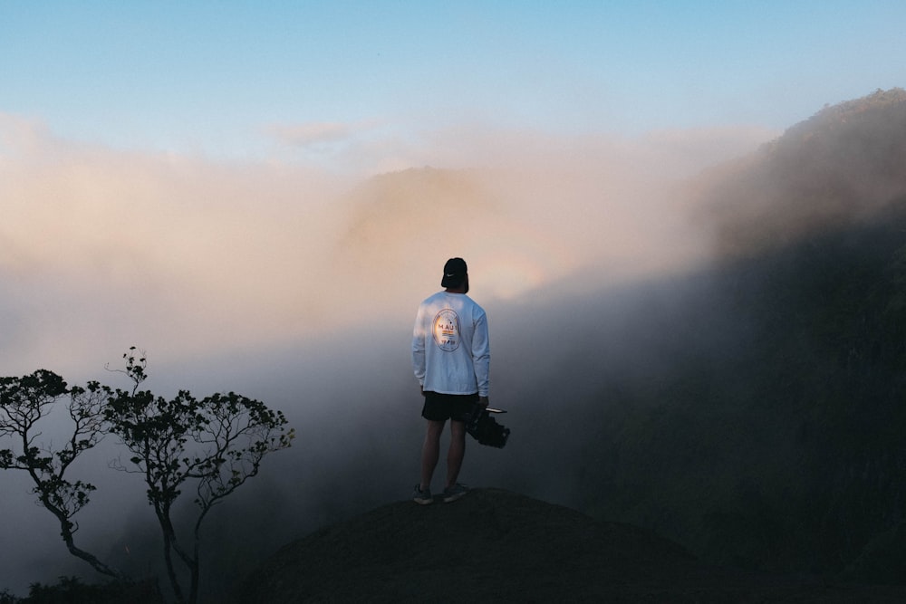 man standing on mountain